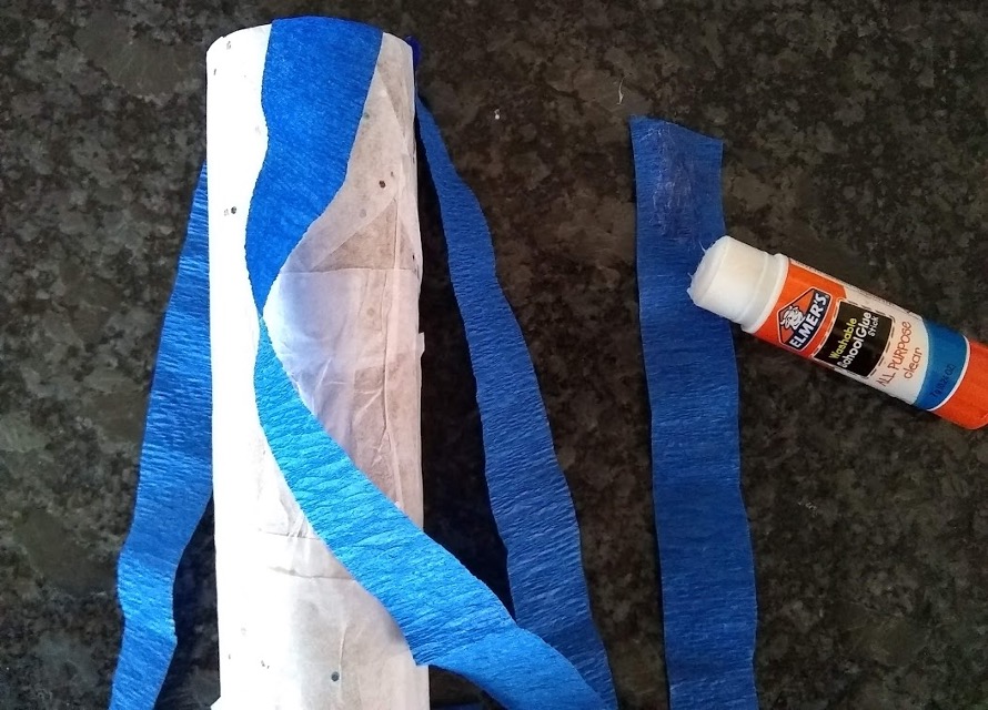 gluing streamers onto the paper roll