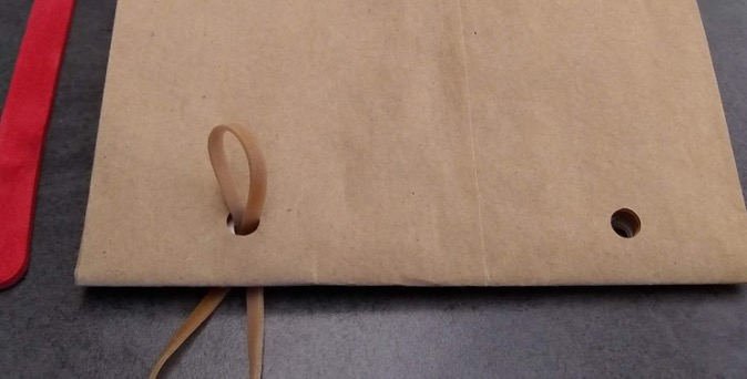 Rubber band through the hole
