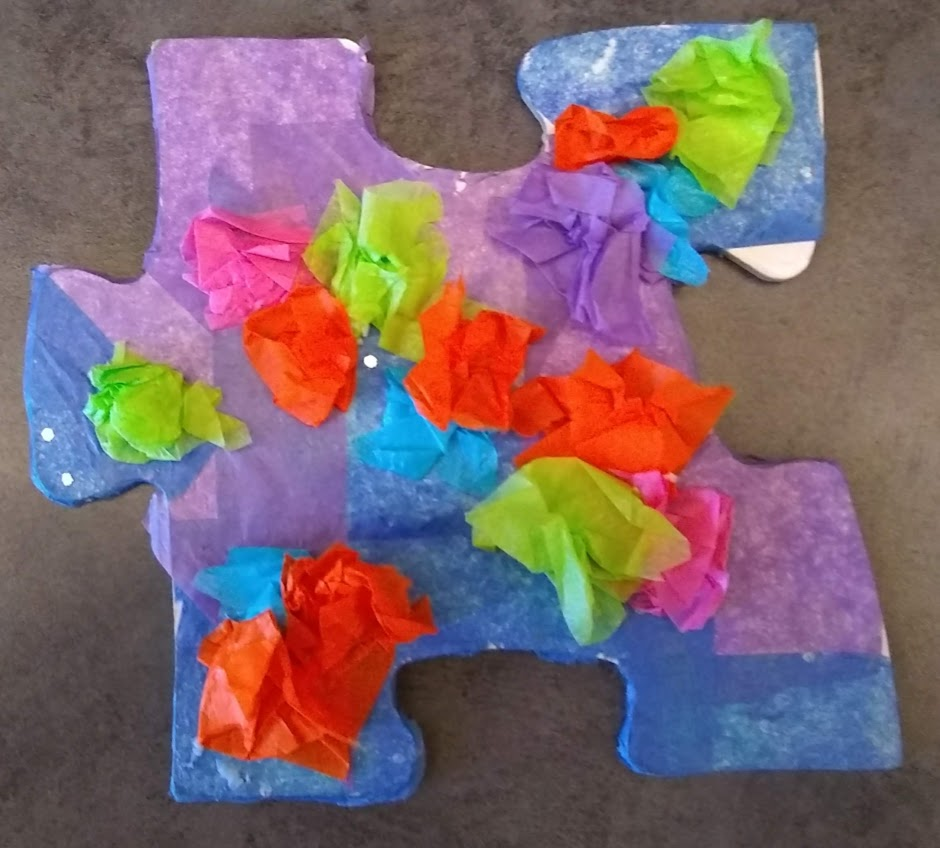 puzzle piece decorated with tissue paper