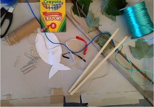 craft supplies - crayons, paper, paperclips, string, chopsticks, scissors