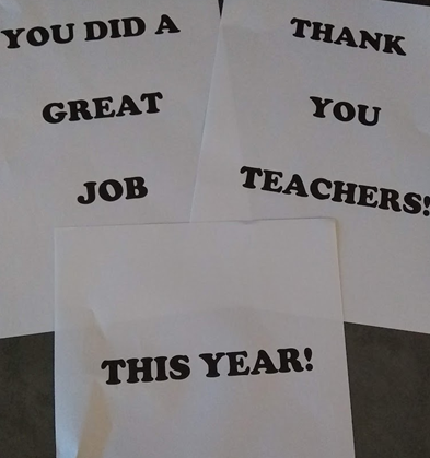 Signs that say "You did a great job this year! Thank you teachers! 