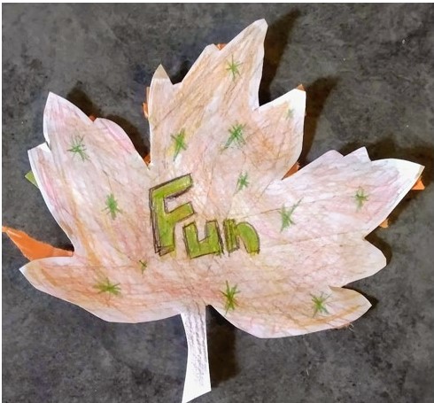 Leaf art project with the word "fun"