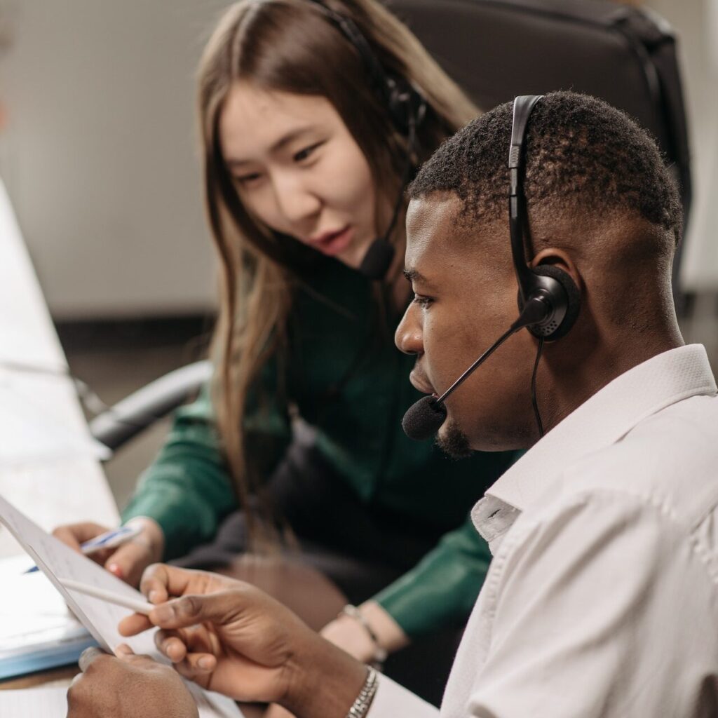 image of man and woman looking at business papers